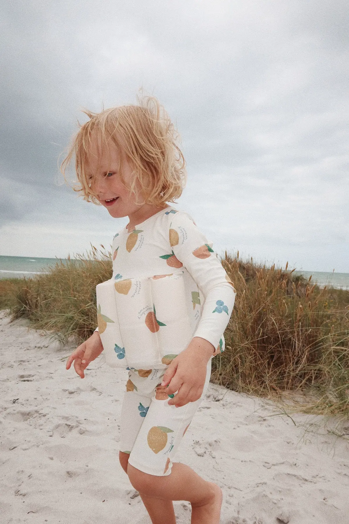 Konges Sløjd Floatsuit Schwimm-Jumpsuit „Fruity“, mit Schwimmhilfe, LSF 50+