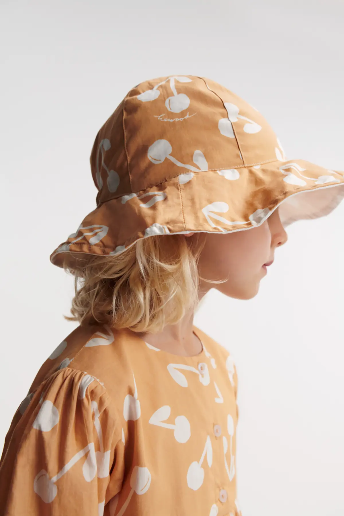 Liewood Wende-Sonnenhut Amelia „Cherry blossom / Light apricot“